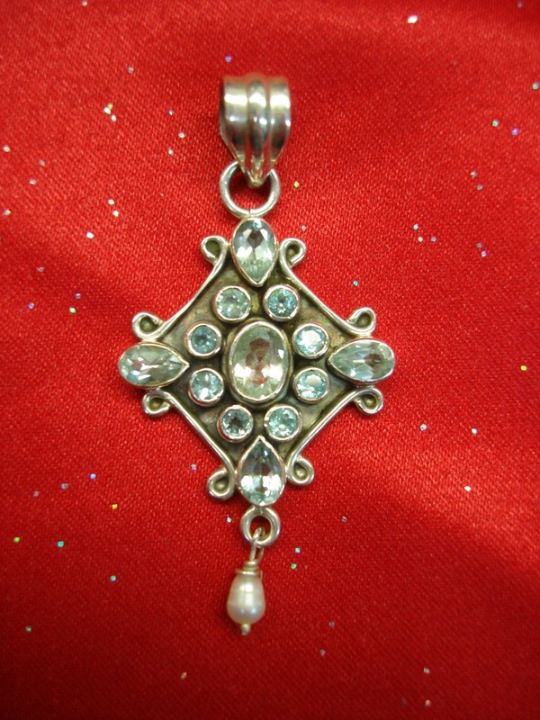 Sterling silver pendant with blue topaz stones and a freshwater pearl