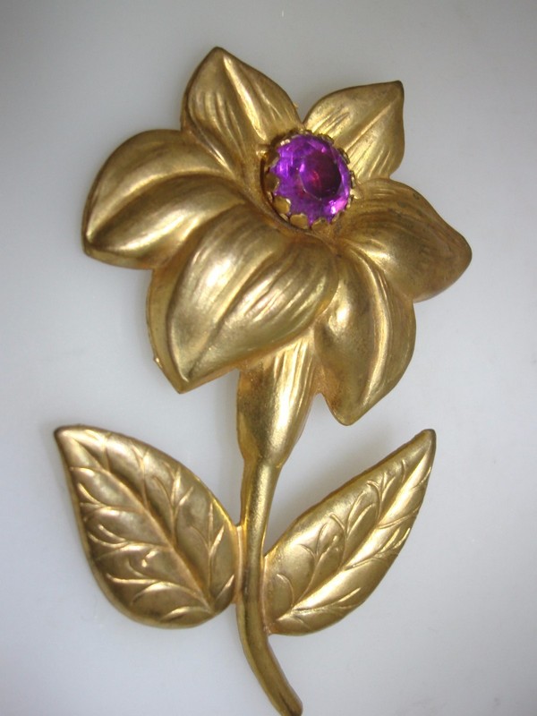 Large gold washed flower pin with amethyst rhinestone, vintage 1940s