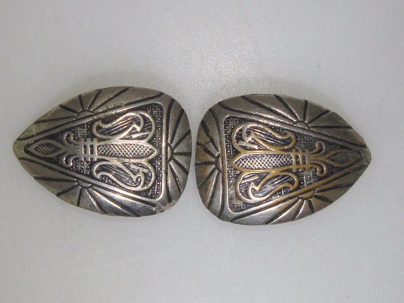 Pair of antique Art Deco silver wash button covers with intricate black enamel design