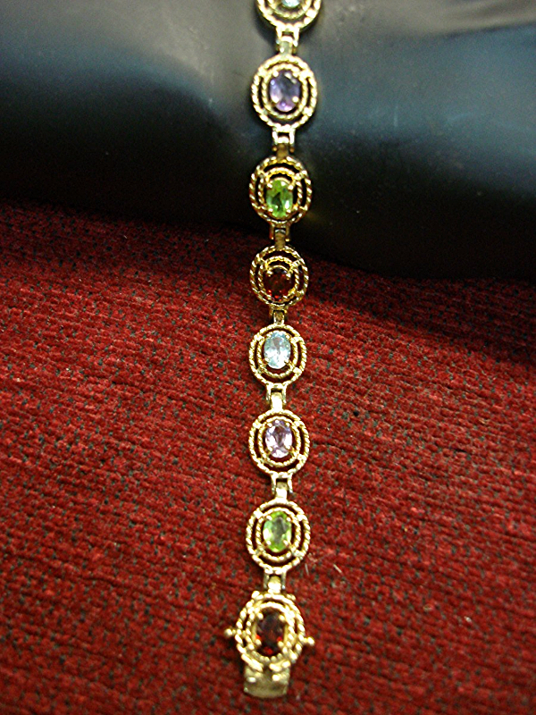 Sterling silver and gold vermeil gemstone bracelet with garnet, peridot, amethyst, and topaz