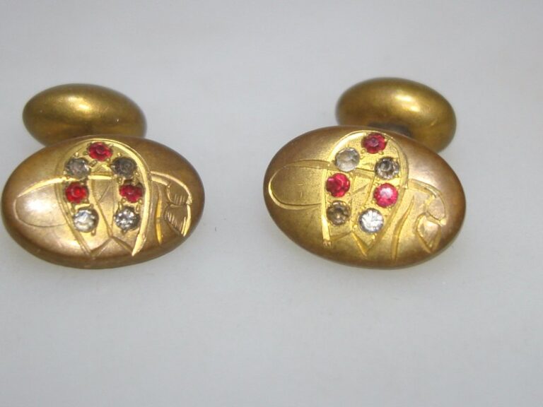 Victorian gold-washed horseshoe and crop cufflinks with red and clear rhinestones