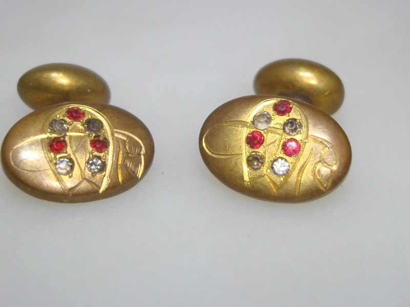 Victorian gold-washed horseshoe and crop cufflinks with red and clear rhinestones