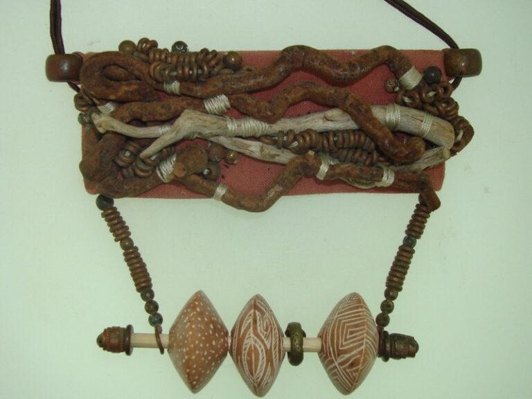 Artisan-crafted African necklace with driftwood, metal, and beads