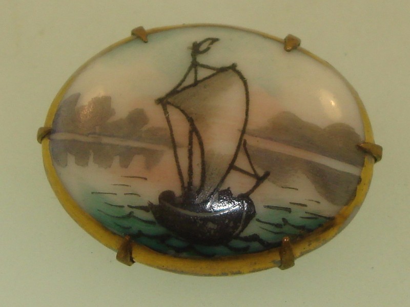 Antique Victorian hand-painted porcelain sailboat pin with gold wash