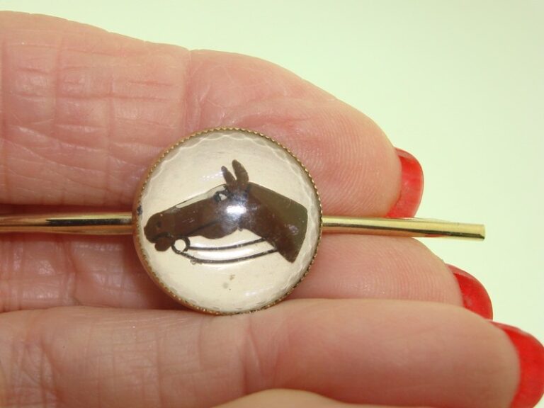 Vintage 1940s-50s gold-tone horse head tie bar with painted glass dome