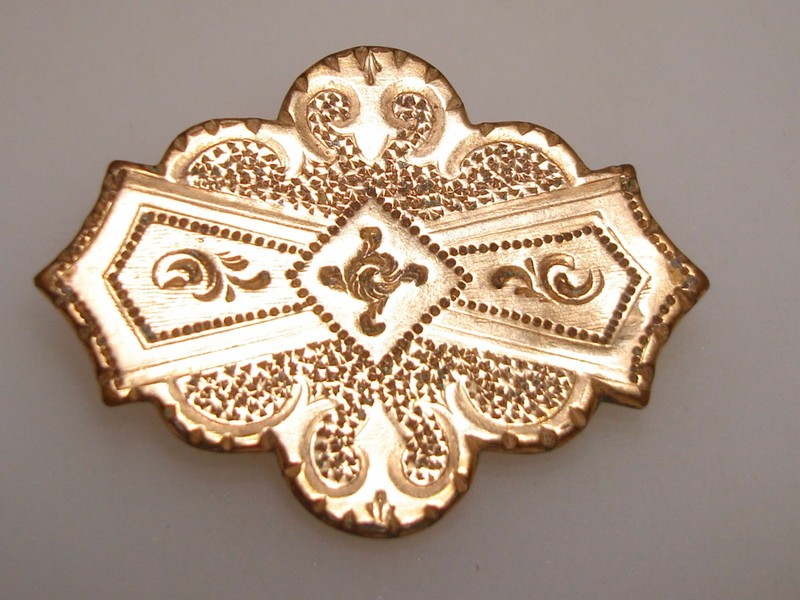 Antique Etruscan gold-washed watch pin with repoussé design and shepherd's hook clasp