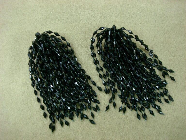 Vintage 1960s-70s black lucite dangle earrings with 28 strands of bicone beads.