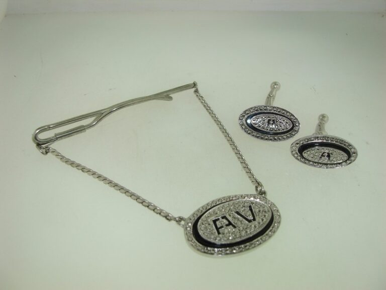 Sterling silver Art Deco tie bar and cufflinks set with black enamel and marcasites, initial AV