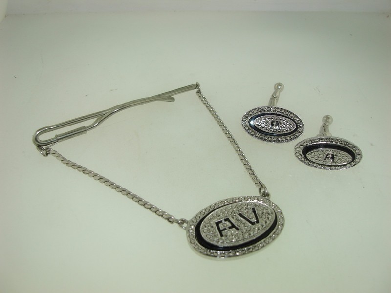 Sterling silver Art Deco tie bar and cufflinks set with black enamel and marcasites, initial AV