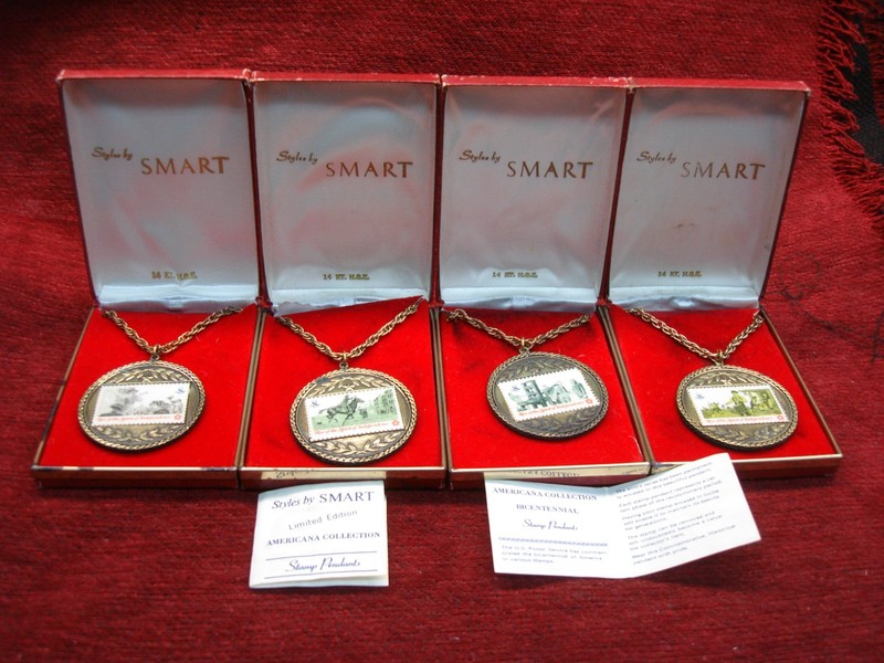Four 14k gold electroplate stamp pendants from the Americana Collection, featuring different US Bicentennial 8 cent stamps.