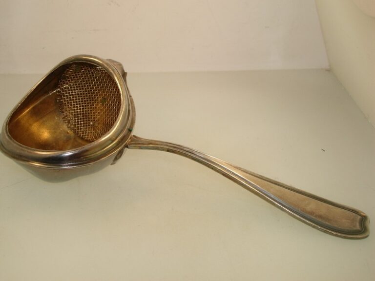 Antique 1900s Paye & Baker silver plate gold-washed tea strainer with Art Deco design