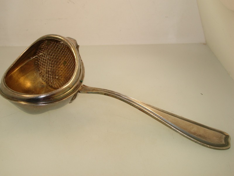 Antique 1900s Paye & Baker silver plate gold-washed tea strainer with Art Deco design