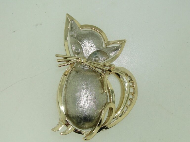Silver and gold-tone cat pin brooch