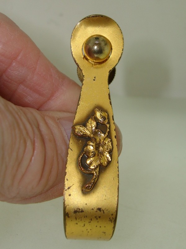Vintage gold-washed pin holder for a pocketbook strap, with a unique floral design