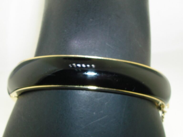 Vintage 1960s black lucite and gold-tone hinged bangle bracelet