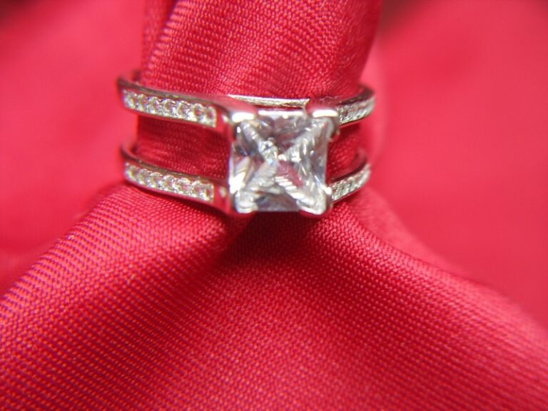 Sterling silver princess cut cocktail ring with sparkling CZ side stones, size 10