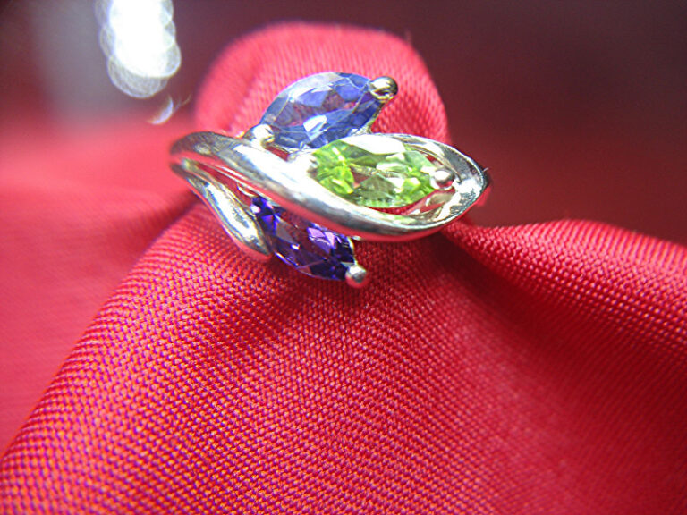 Sterling silver ring with blue, purple, and green gemstones