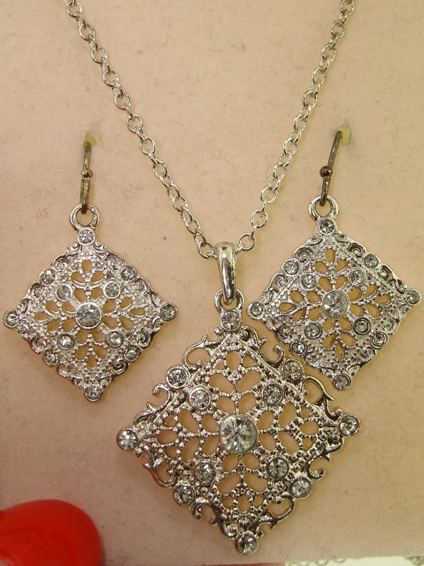 Silver-tone filigree necklace and earring set with rhinestones