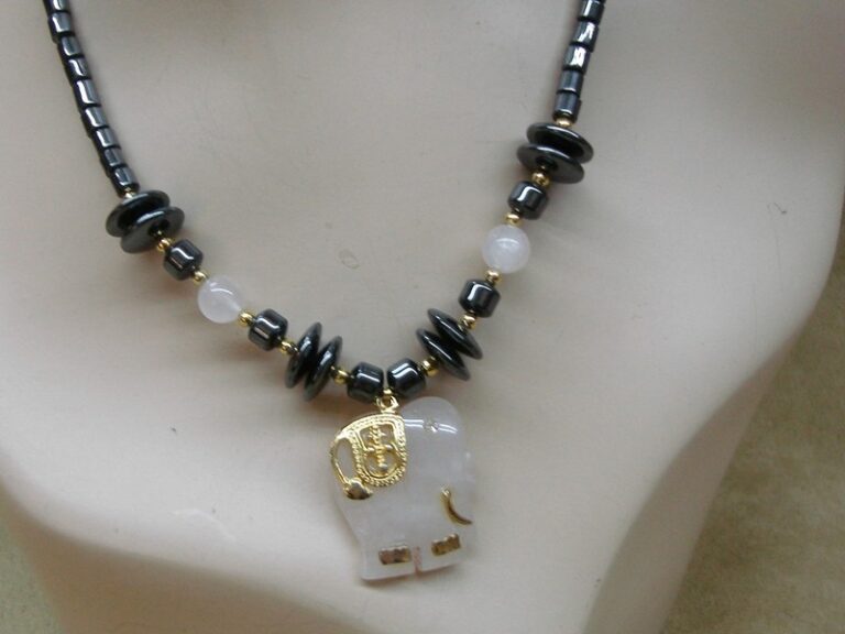 Vintage hematite and rose quartz elephant pendant necklace with gold details