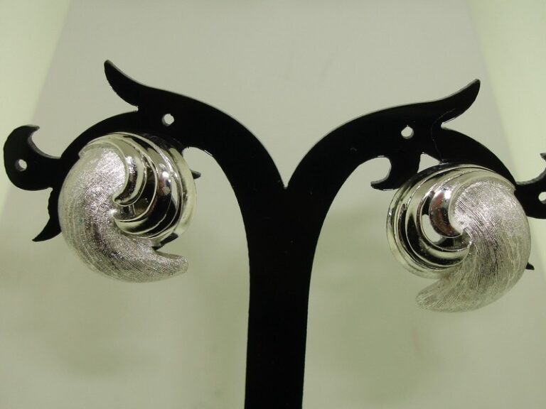 Vintage 1960s Crown Trifari swirl clip-on earrings in brushed and polished silver