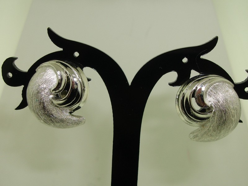 Vintage 1960s Crown Trifari swirl clip-on earrings in brushed and polished silver