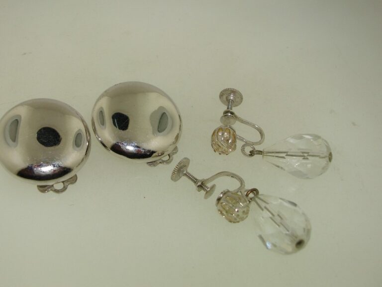 Vintage Coro Earrings Set: Two pairs of classic silver clip-on earrings and crystal dangle earrings.