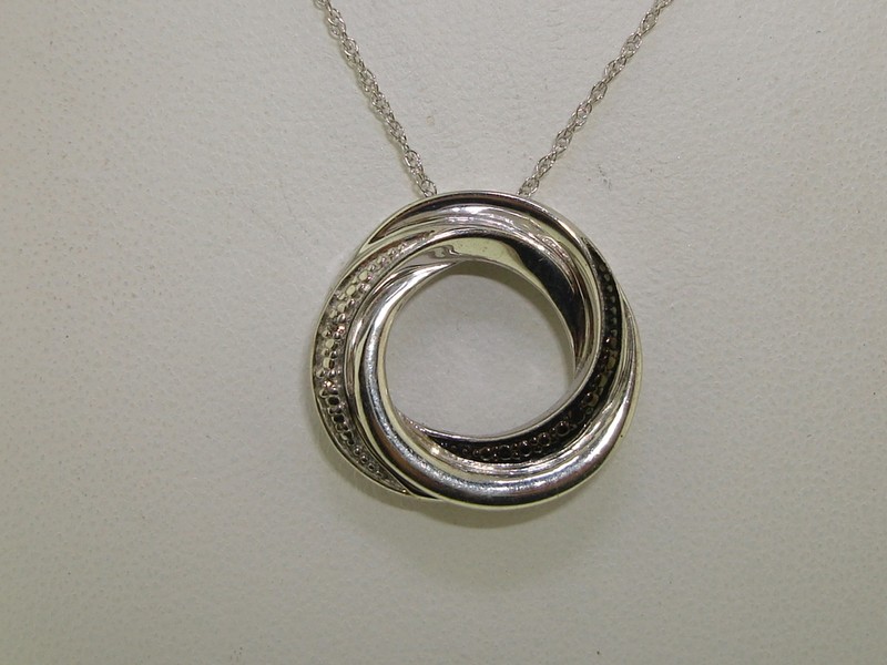 Sterling silver pendant necklace with black and white diamonds