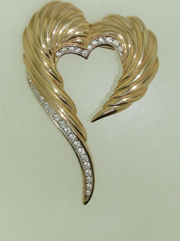 Gold-tone heart pin with sparkling rhinestones, signed SKY