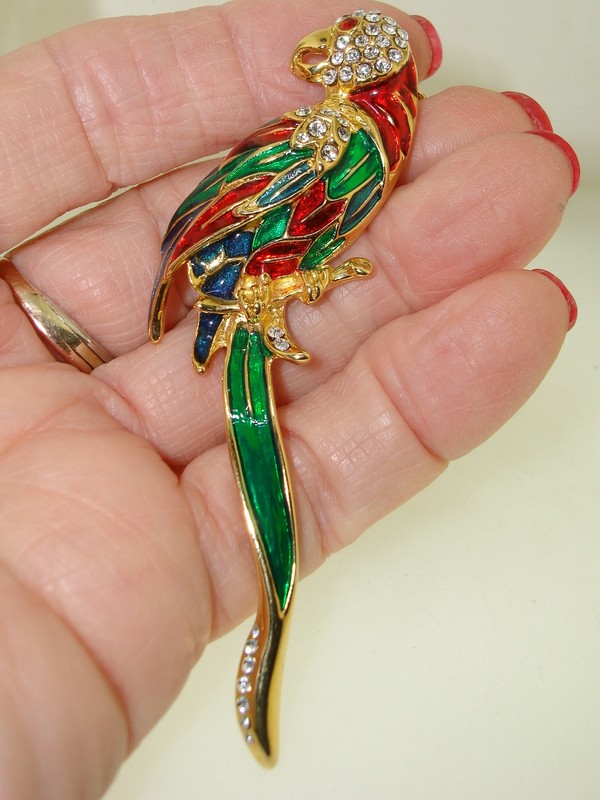 Vintage enamel parrot brooch pin with sparkling CZ accents in red, green, and blue