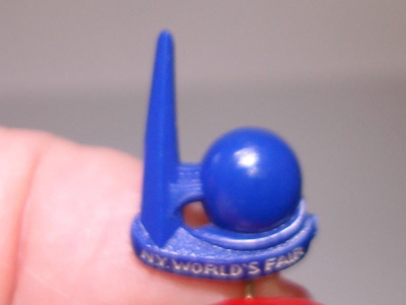 Vintage 1939 New York World's Fair blue lucite pin featuring the Space Needle.