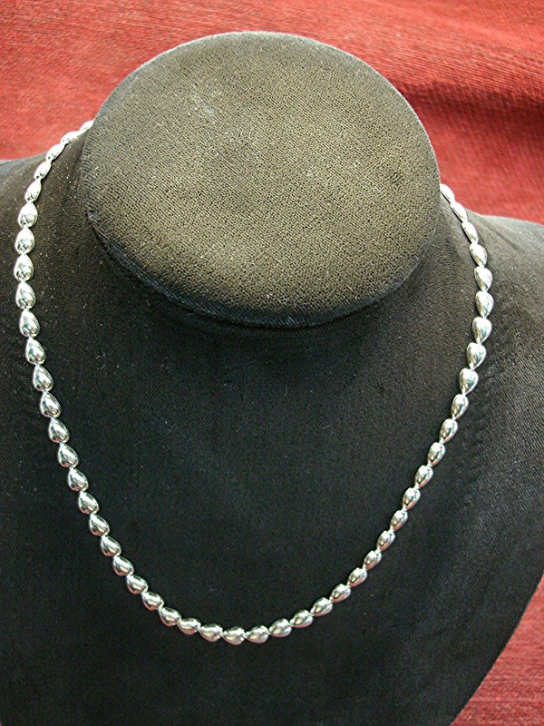Sterling silver heart necklace with a delicate chain of linked hearts