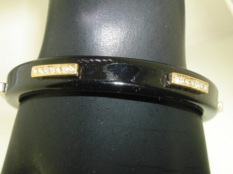 Black lacquer bangle bracelet with gold accents and rhinestones
