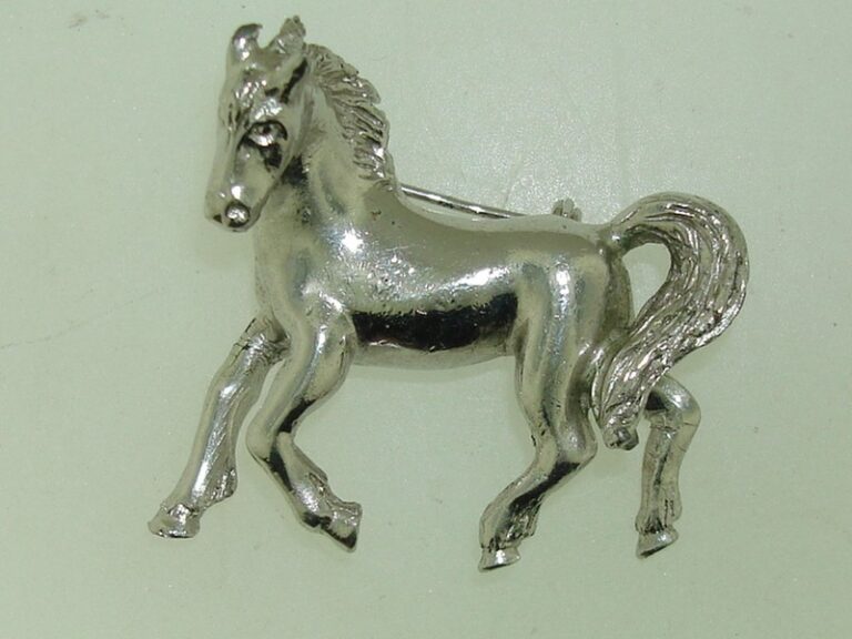 Vintage 1960s silver galloping horse pin