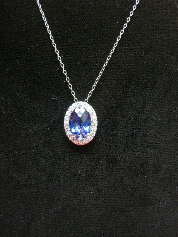 Sterling silver necklace and pendant with blue topaz and clear topaz stones