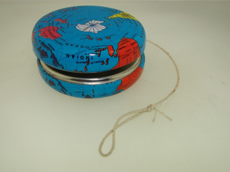 Vintage blue metal yo-yo with a world map lithograph design
