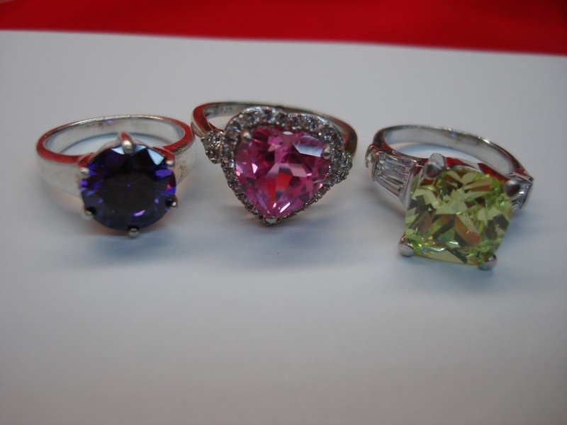 Set of 3 unique sterling silver rings with peridot, pink ice, and amethyst gemstones