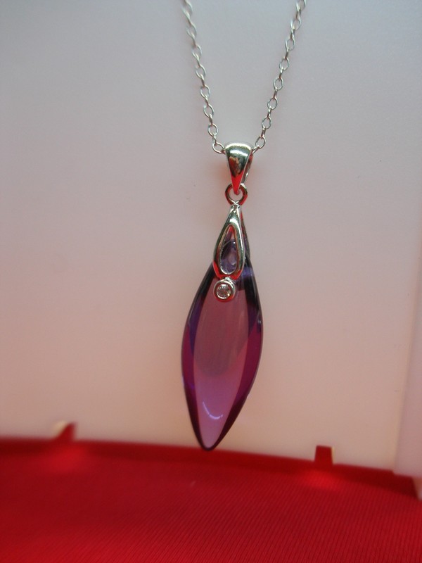 Sterling silver marquise pendant necklace with purple stone and CZ accents