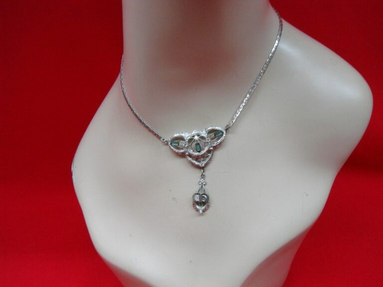 Art Nouveau filigree necklace with PO OF A emblem, blue rhinestones, and enamel detailing