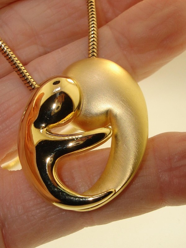 Gold-tone mother and child pendant necklace