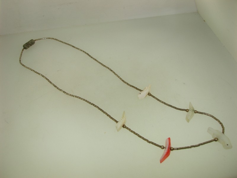 Vintage Native American bird fetish necklace with liquid silver and mother-of-pearl beads.