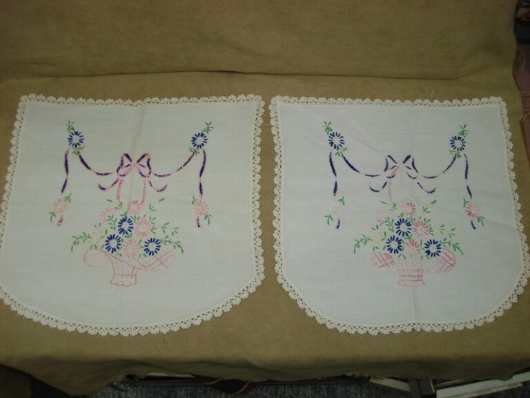 Pair of vintage linen armrest covers with handwork crewel embroidery and crocheted edges