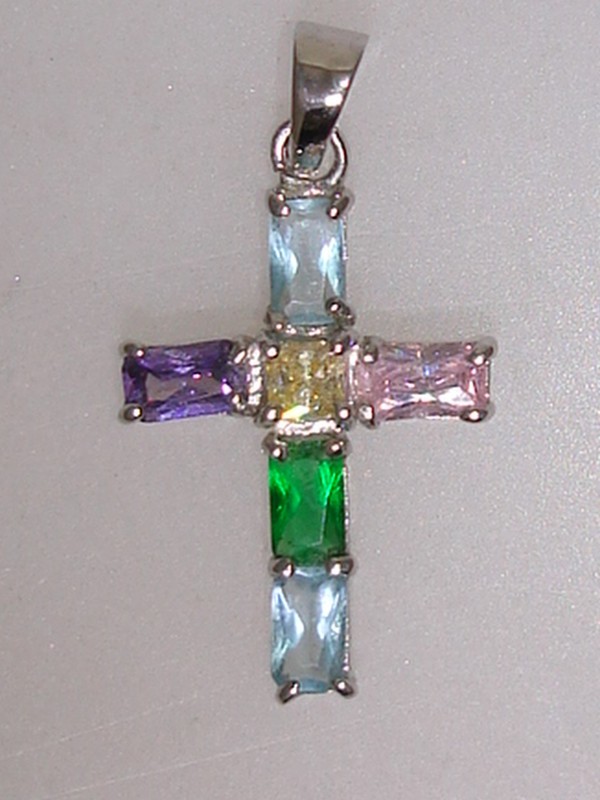 Silver rhinestone cross pendant with emerald and princess cut stones
