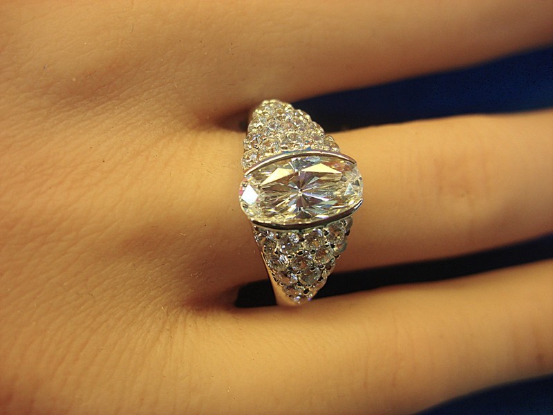 Sterling silver cocktail ring with a sparkling DQ CZ halo and round CZ accents