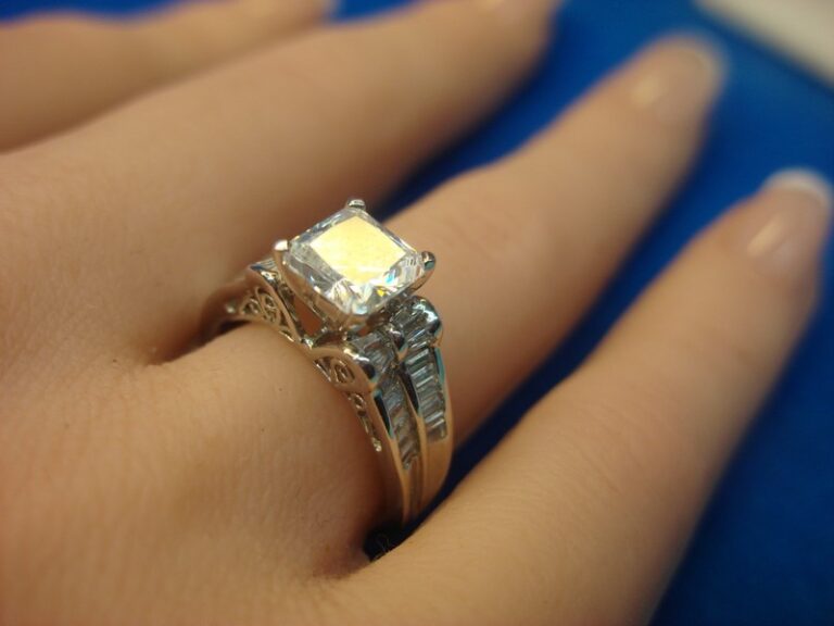 Sterling silver cocktail ring with simulant diamonds, princess cut design, size 7