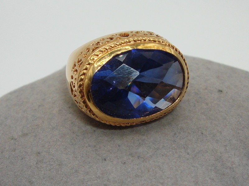 Gold plated sterling silver statement ring with blue glass stone, size 6.25