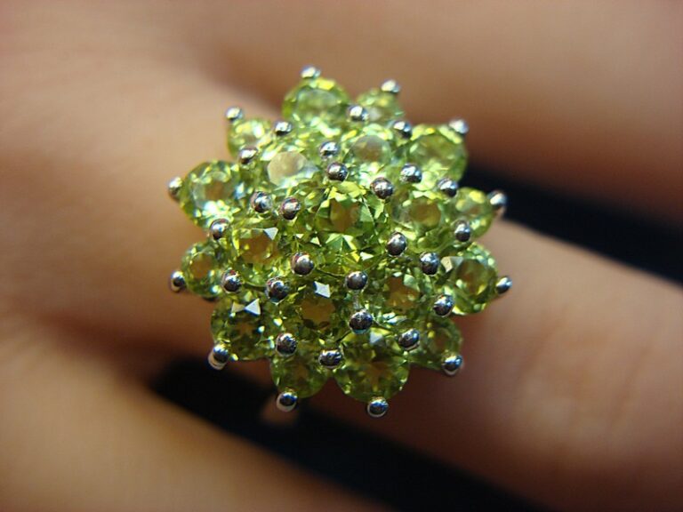 Sterling silver ring with round peridot gemstones, size 7
