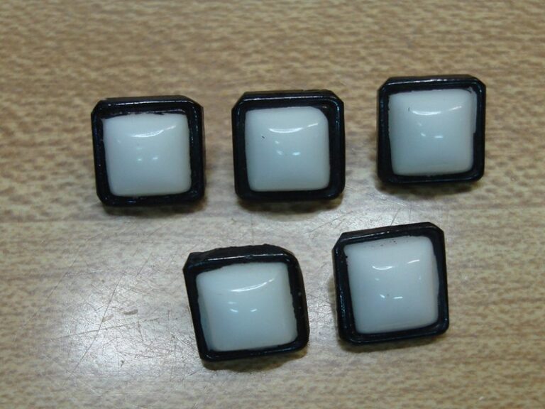 Set of 5 vintage milk glass buttons with black trim, mid-century style