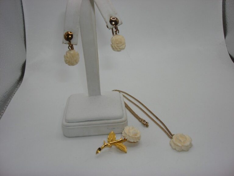 Vintage carved celluloid rose jewelry set, necklace, pin and earrings from the 1940s-50s.