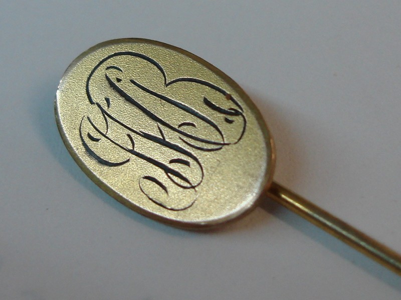 Antique gold-plated initial stick pin engraved with JHB