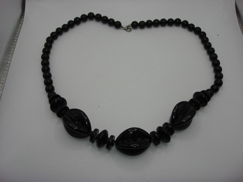 Vintage black lucite boho necklace with 9.2mm beads, statement disc beads, and four-panel beads.